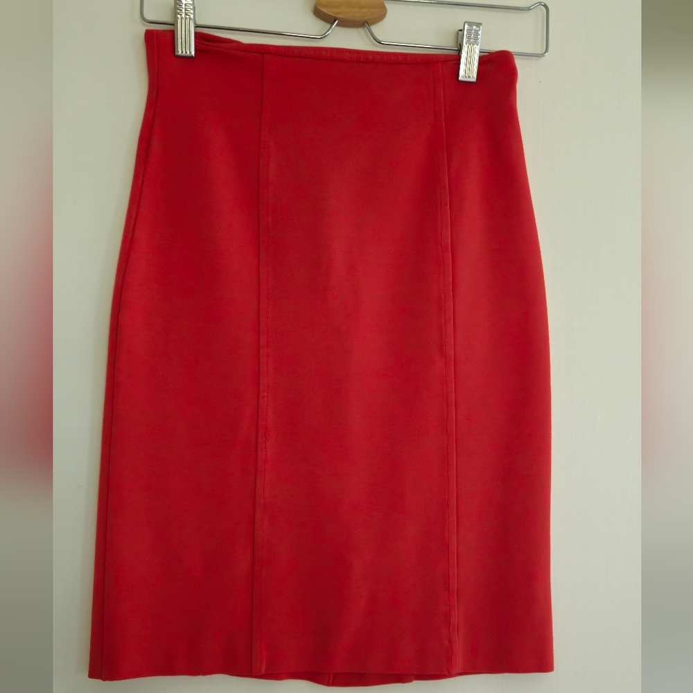Knee length orange midi skirt